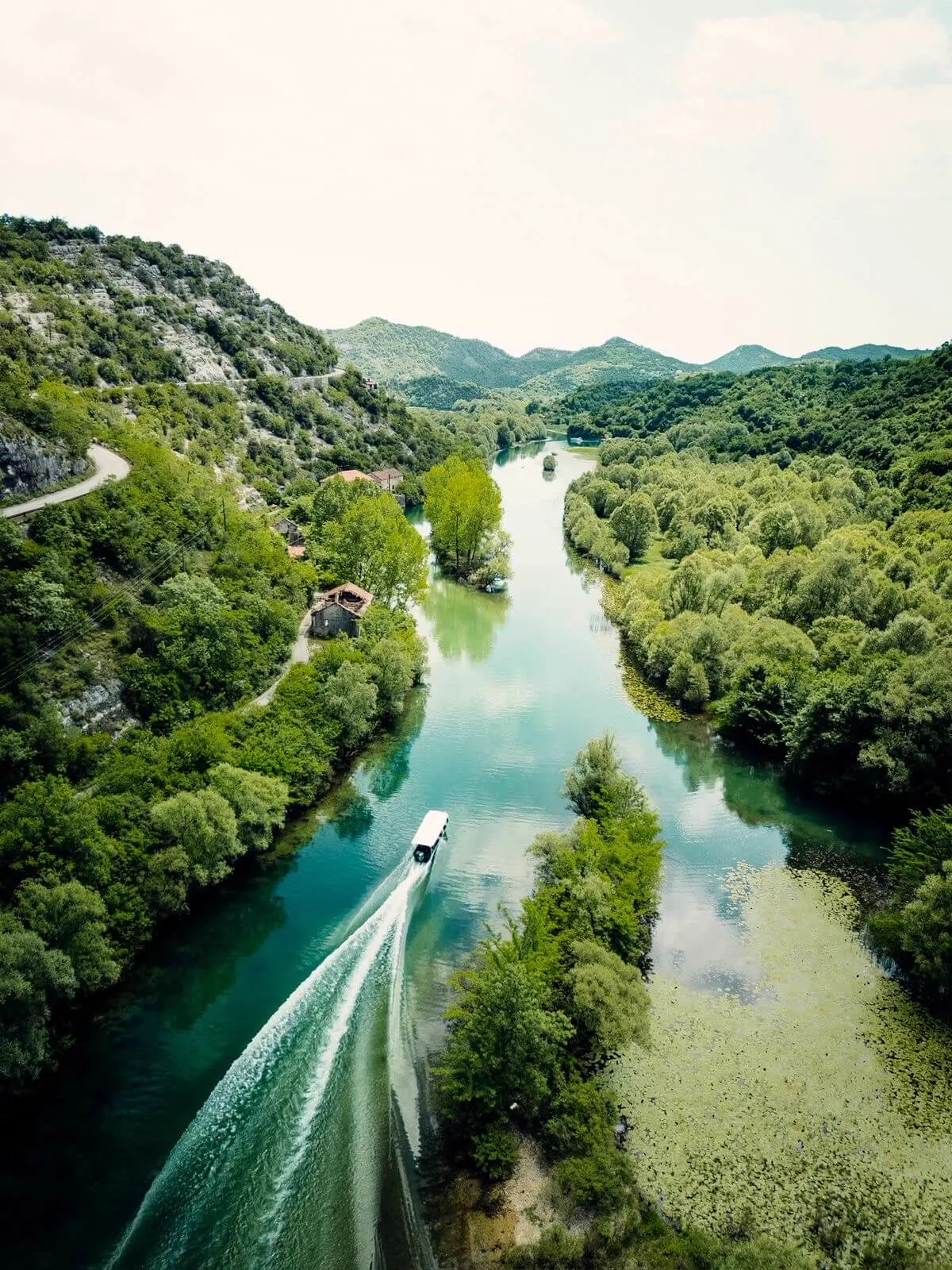 Aerial view of a boat leaving a wake on Lake Skadar
